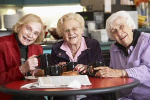 Senior women drinking tea together