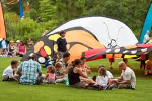 Families Enjoy Picnic Lunch At Summer Butterfly Festival