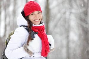 Woman winter hiking. Beautiful young Asian woman enjoying the fa