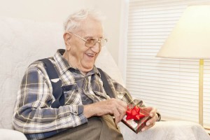 Elderly-Man-Opening-Gift by Cheryl E. Davis-50150132