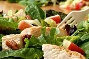 Fresh healthy salad with grilled chicken and apples.  Macro with